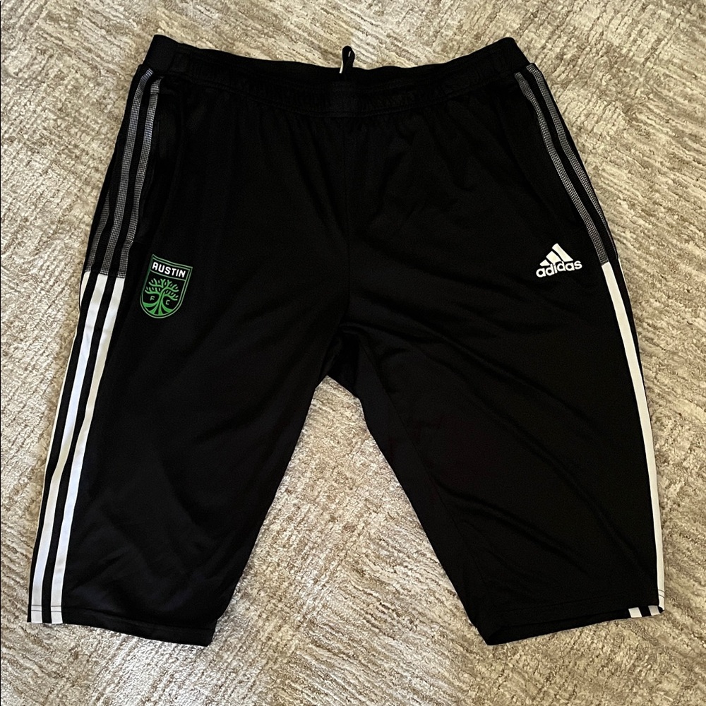 Adidas Black Shorts with Green Emblem and White Stripes